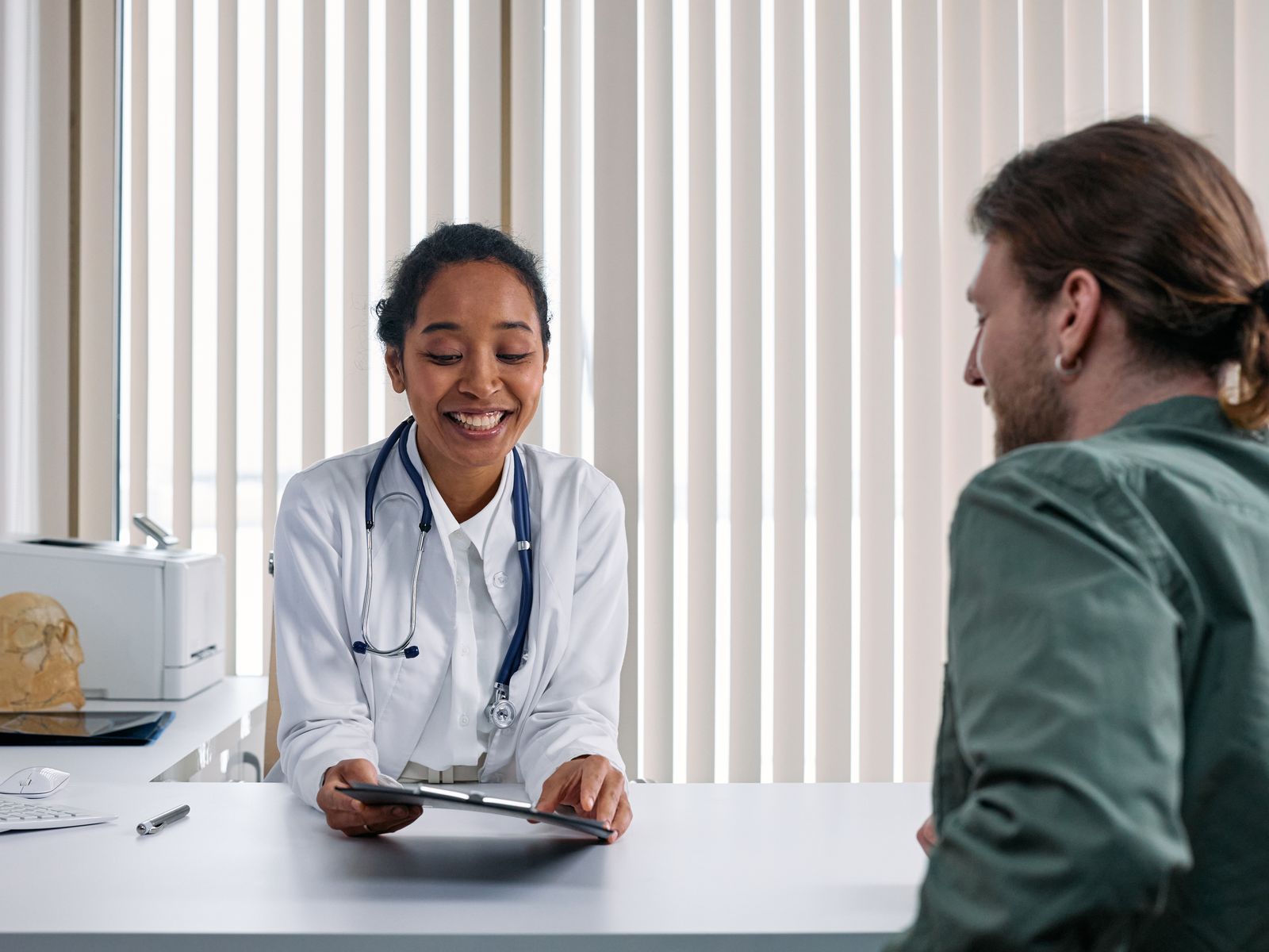 A Canada House clinician consulting with a Veteran patient during an appointment